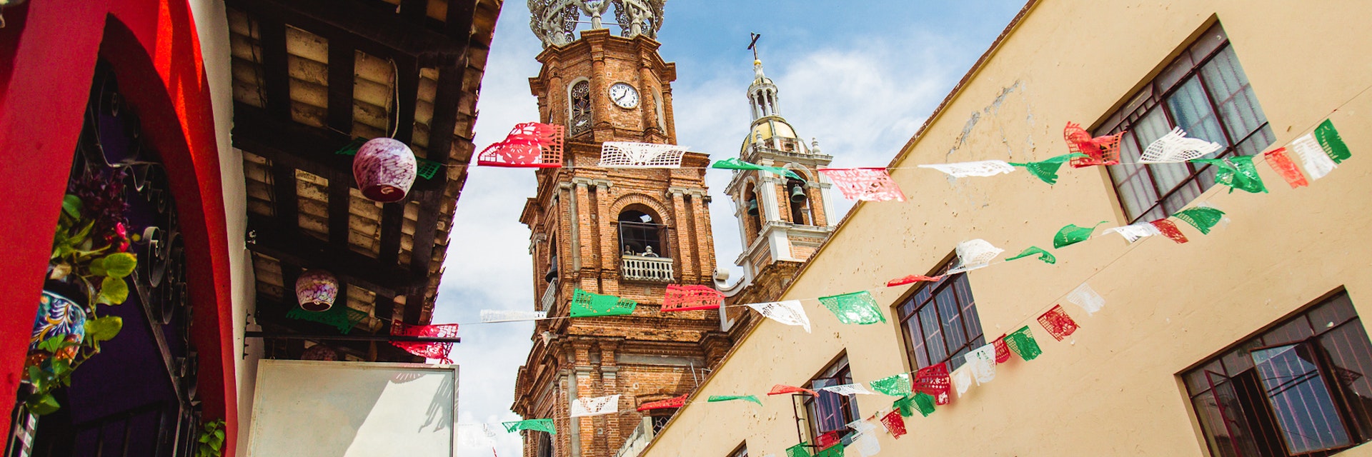Church Steeple and Flags in street